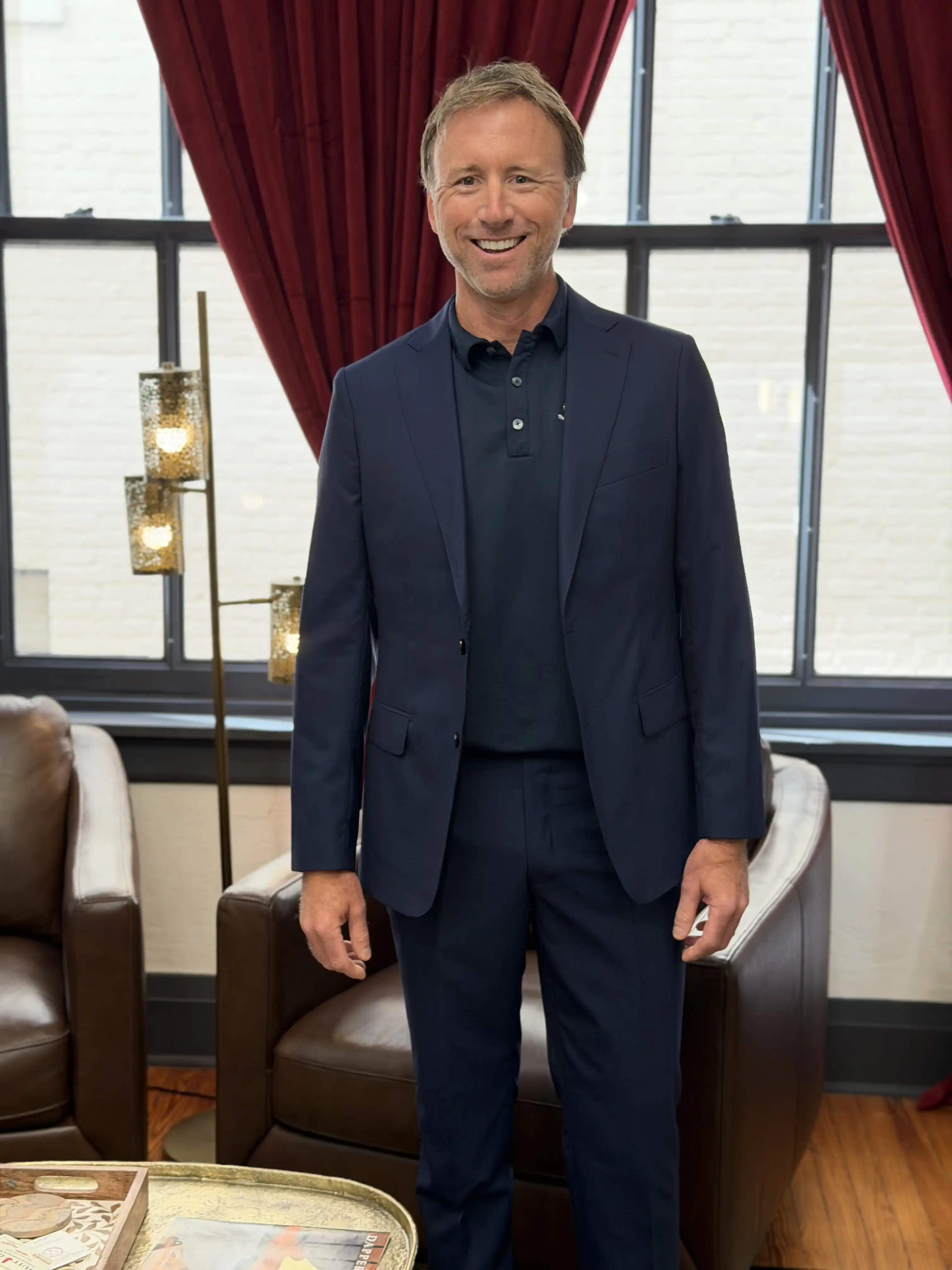A client in a custom navy two-piece suit