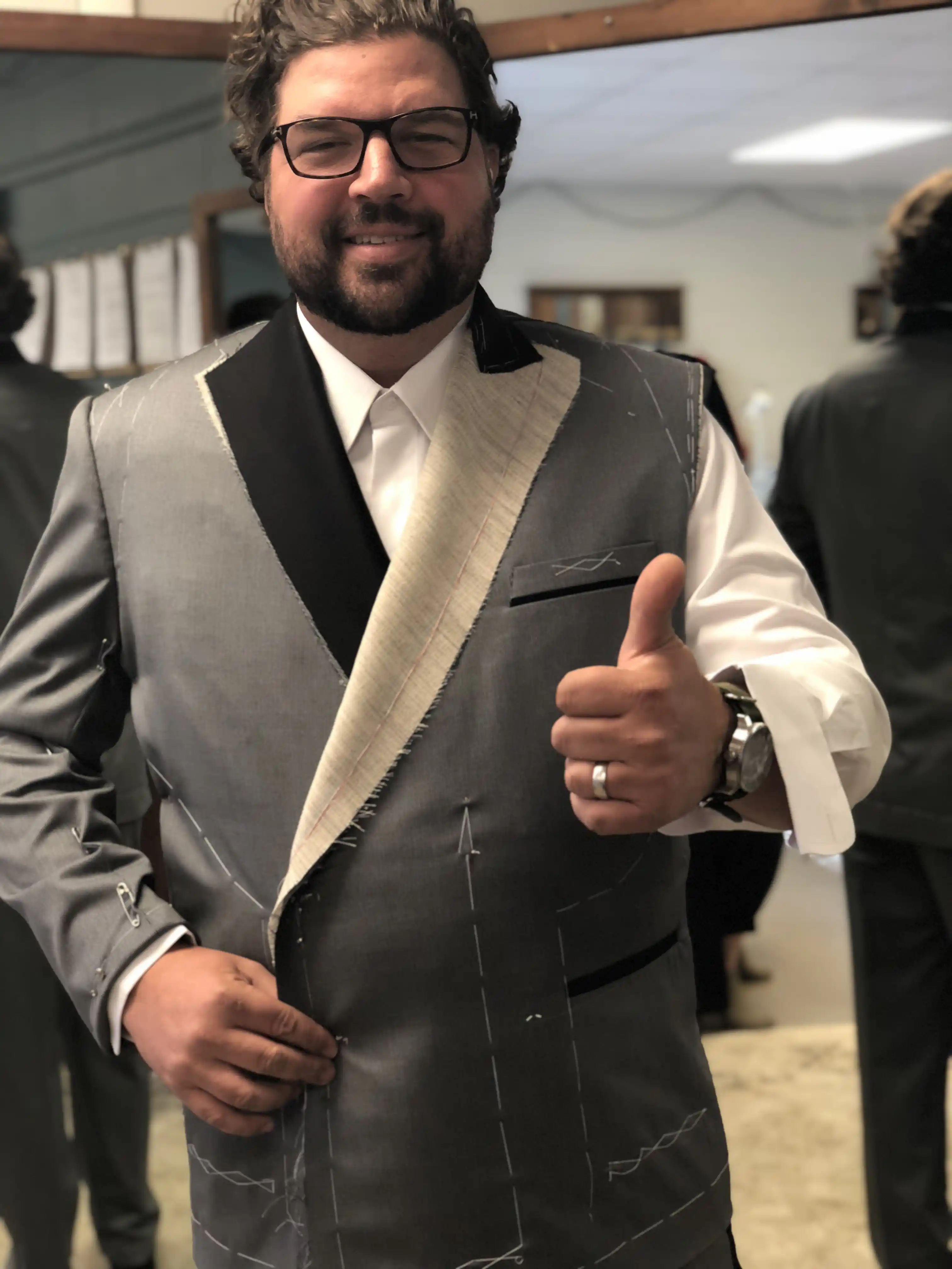 Tailor reading balance lines on a first-fit garment, Florida Suit Guy
