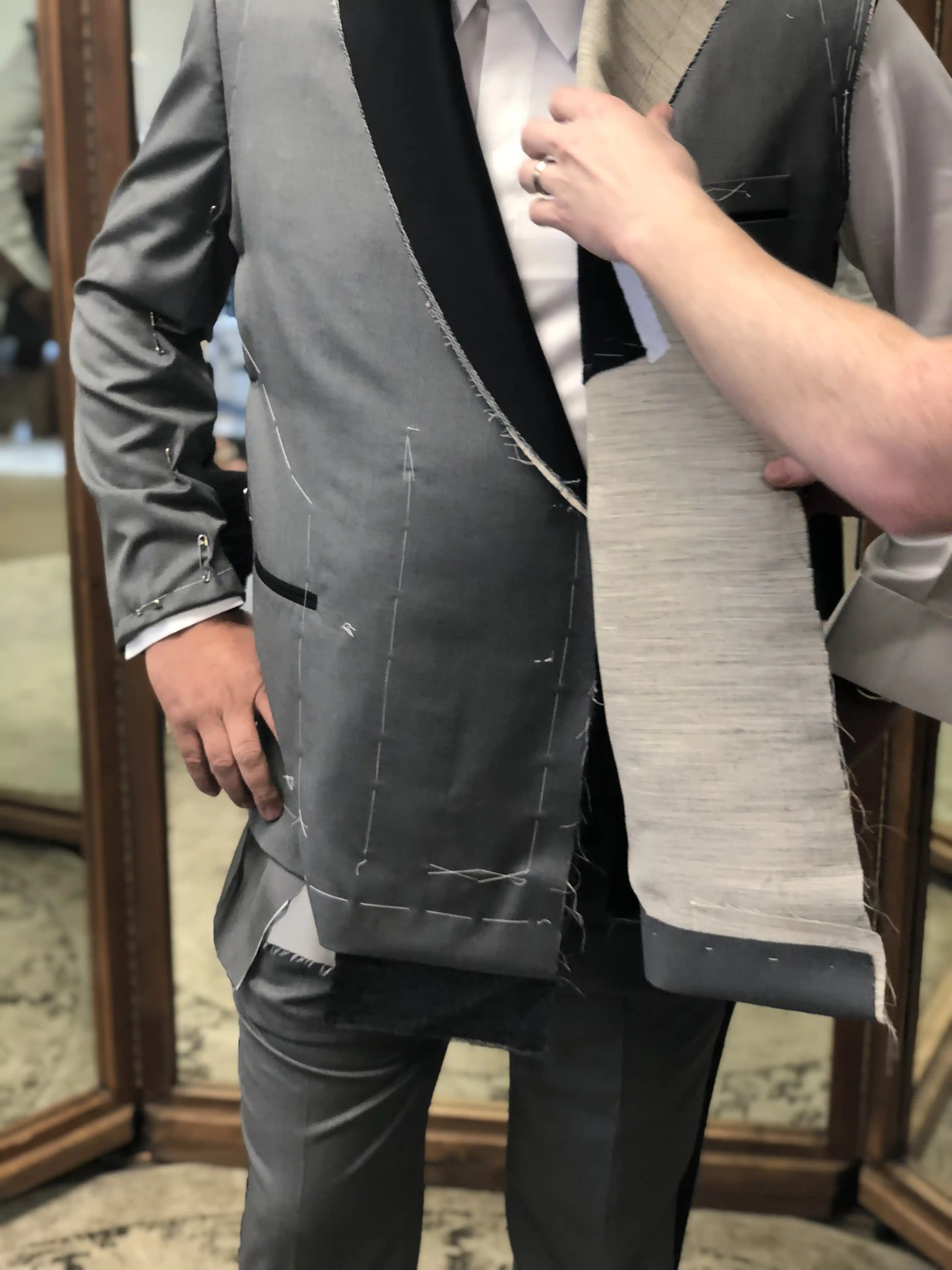 Chalk marks and pins applied to first-fit garment during fitting, Fort Myers FL