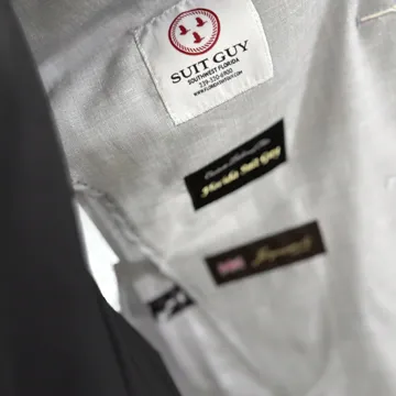 Inside of a finished custom jacket showing the Suit Guy label and lining