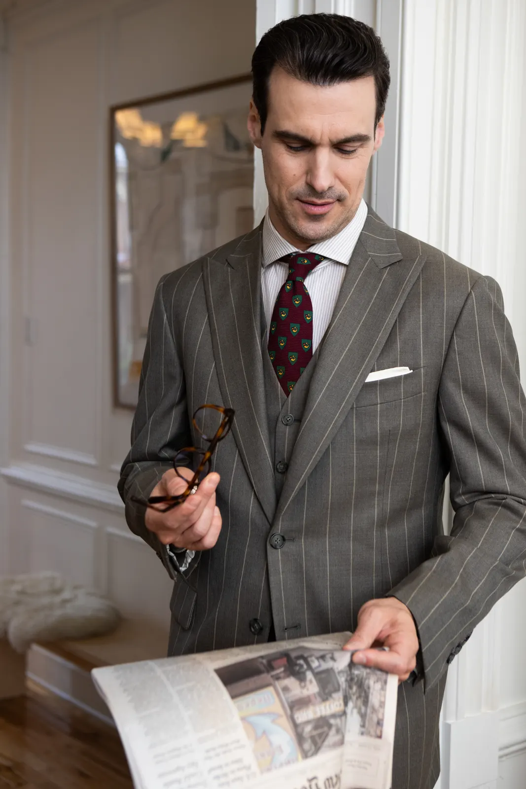 A gray three-piece suit with a waistcoat and a pocket square