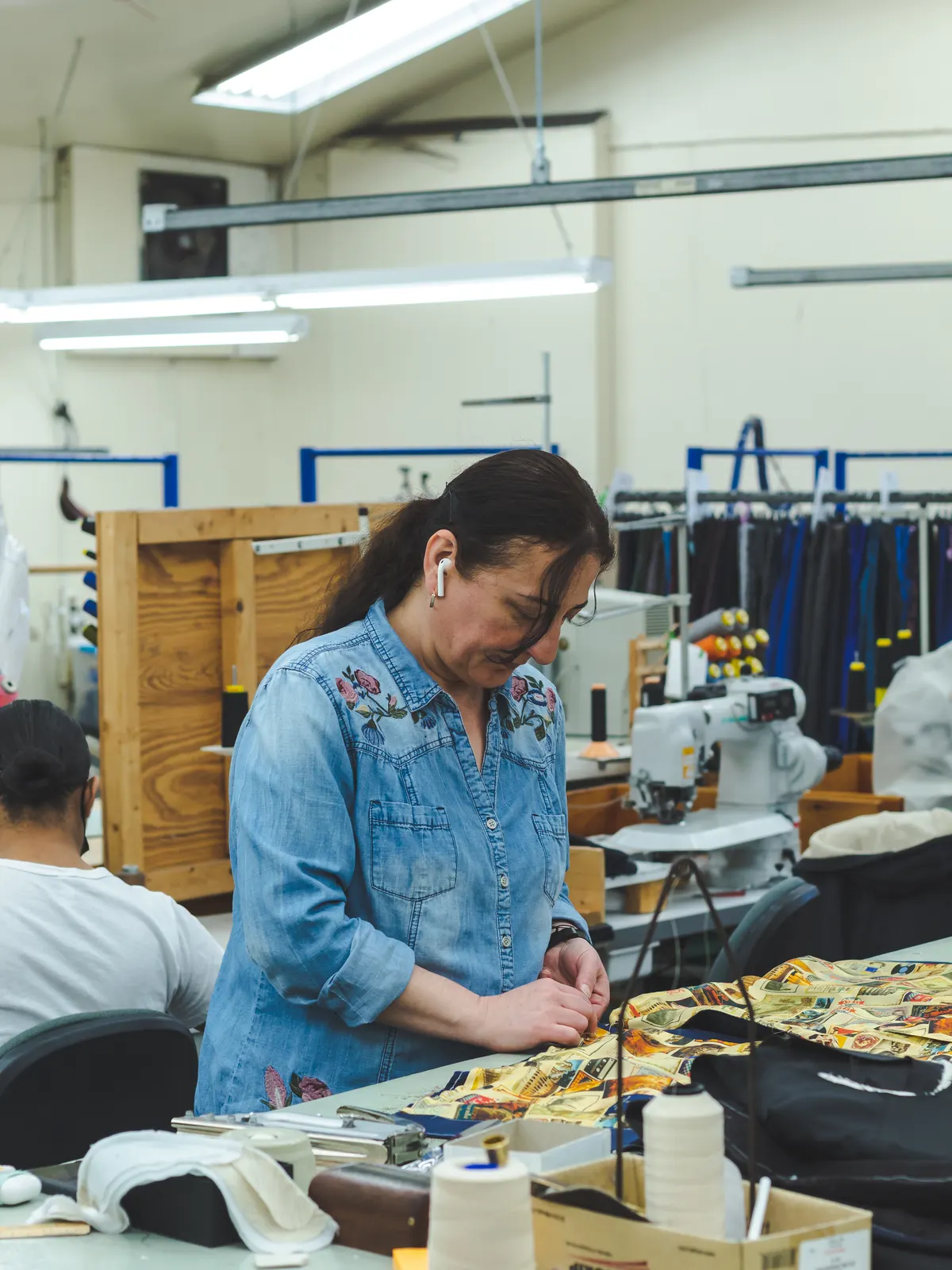 A sewing operator at work on the workshop floor