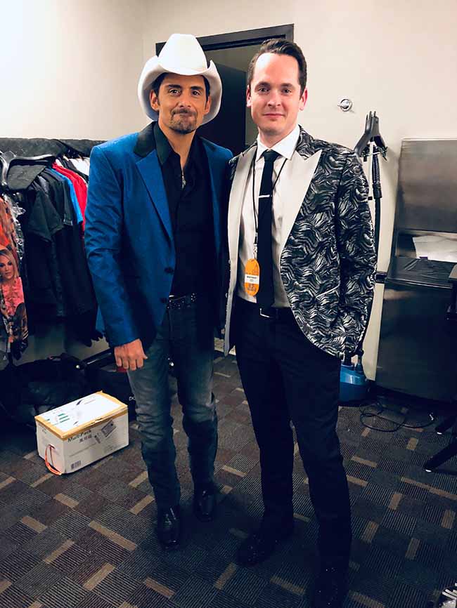 Aaron McGill with Brad Paisley backstage, both in custom jackets