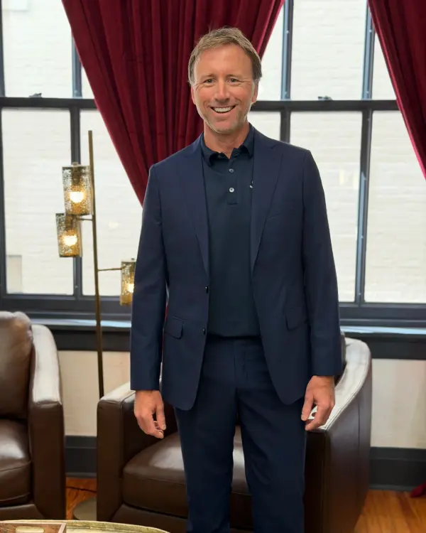 A client in a custom navy two-piece suit
